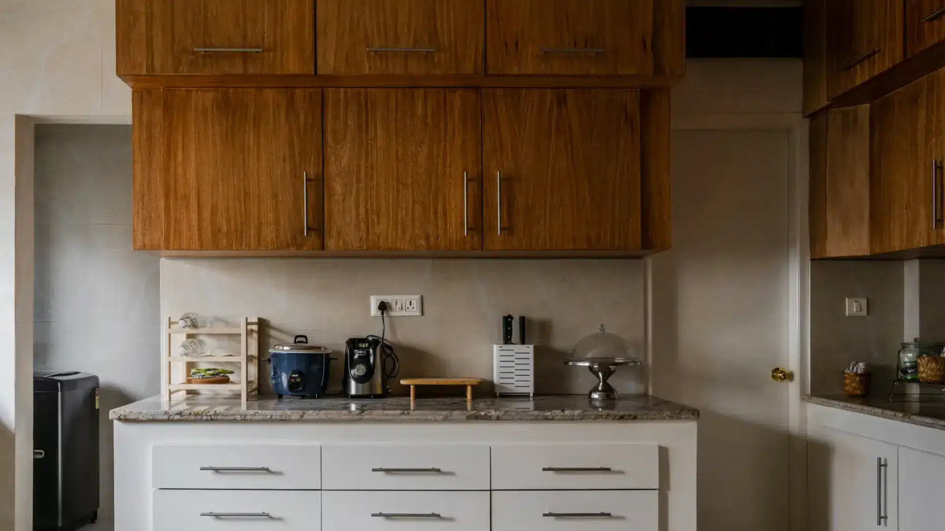 finished wood cabinet doors installed in a kitchen above a white countertop
