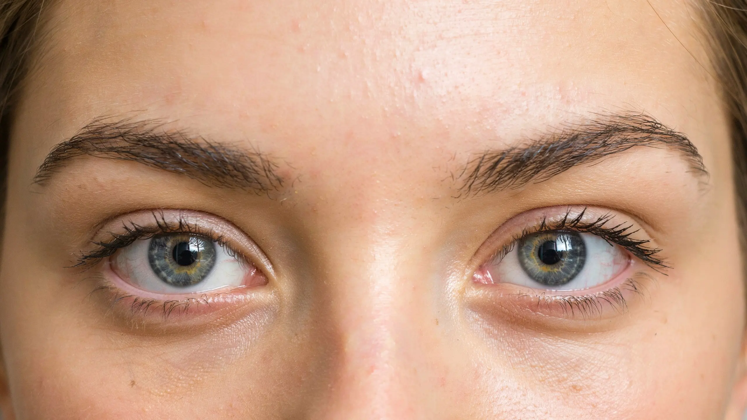 Close-up of a woman's eyes showcasing a wide set eye shape with defined lashes.