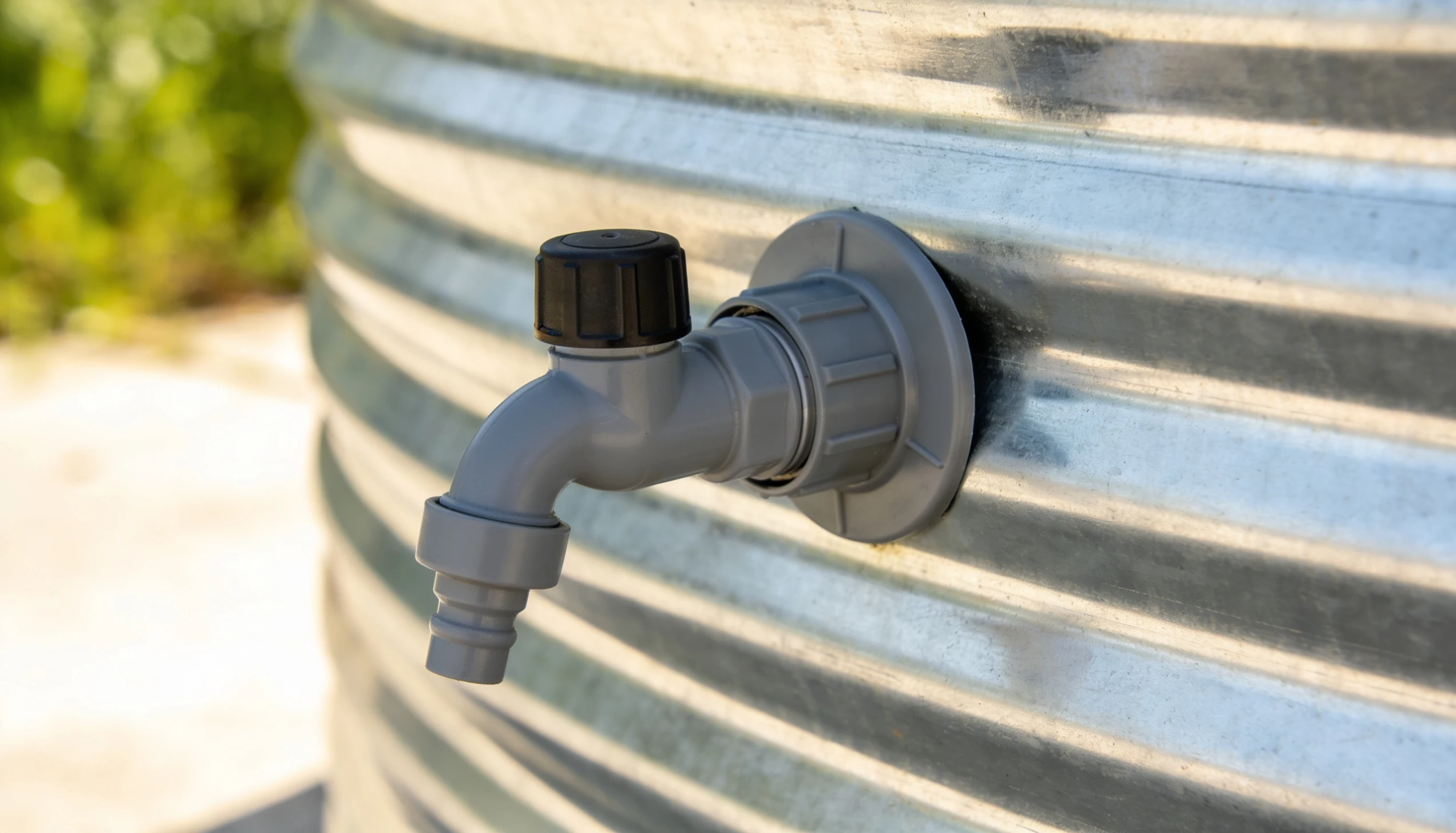 stock tank pool plunger valve attached to galvanized tank